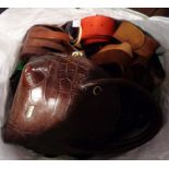 A bag containing a quantity of leather belts, handbag, etc.