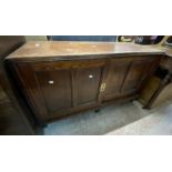 A 1.17m early 20th Century stained pine record cabinet with fitted interior enclosed by two