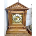 An early 20th Century German walnut cased table clock of architectural design with Junhans eight day