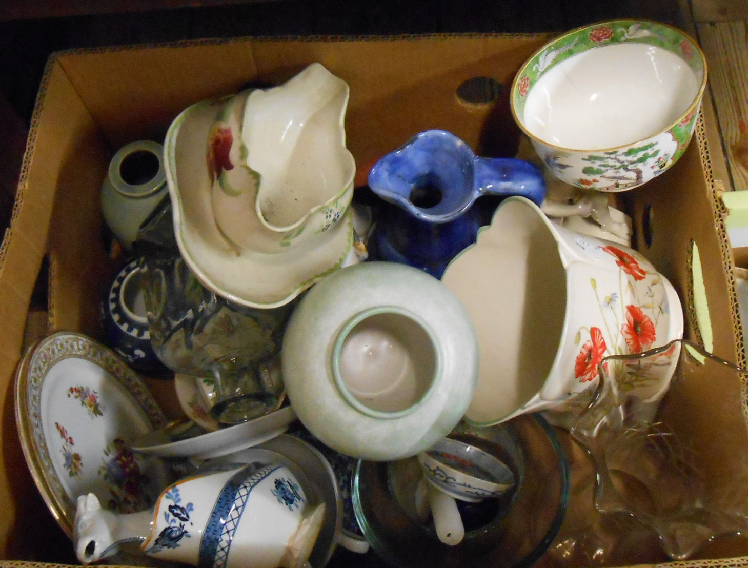 A box containing assorted ceramic items including Staffordshire cow creamers, etc. - various