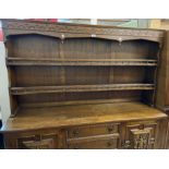 A 1.68m 20th Century polished oak two part dresser with galleried two shelf open plate rack over a