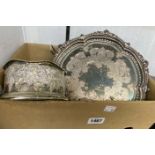 A box containing a quantity of silver plated items including circular tray, wine coasters and