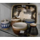 Six pieces of studio pottery comprising a Marianne De Trey dish decorated with a billy goat,