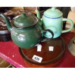 Two small vintage green enamel teapots - sold with an old wooden stand