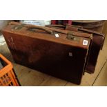 An old leather suitcase - sold with a similar satchel
