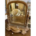 A Victorian walnut platform dressing table mirror with flanking barley twist supports and serpentine