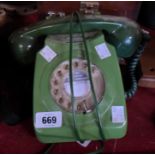 A vintage telephone in green plastic