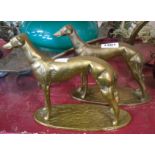 A pair of cast brass greyhound figurines