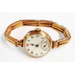 An early 20th Century 9ct. rose gold lady's wristwatch with Swiss movement and expanding