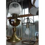 An old brass oil lamp with chimney and etched globe shade - sold with a vintage electric hanging