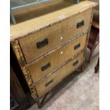 A 76cm late Victorian bamboo chest of three long drawers with woven rush drawers fronts and
