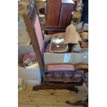 An early 20th Century American walnut rocking chair with studded upholstered back and seat panels