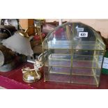 A small brass caged and glass fronted display case - sold with a lamp