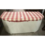 A Lloyd Loom style bow front ottoman with later white painted finish