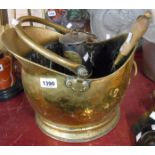 A brass helmet coal scuttle and shovel - sold with a brass and steel The Protector Miners Lamp