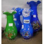 Four vintage decorative glass vases with applied flowers and crimped tops