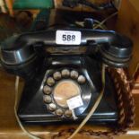 A vintage black Bakelite telephone - sold with its switchbox