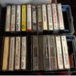 Two cassette storage boxes containing assorted cassettes