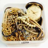 A tub containing a quantity of assorted costume jewelley necklaces and other items, also a vintage