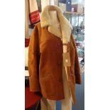 An old sheepskin jacket - tear to arm