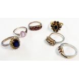 A 9ct. gold blue and white stone cluster ring - sold with five dress rings