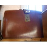 A vintage leather satchel style briefcase