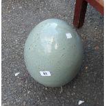 A large stoneware garden egg ornament
