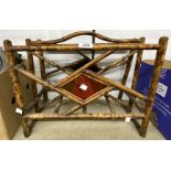 A late Victorian bamboo magazine rack with remains of lacquered panel decoration - sold with a