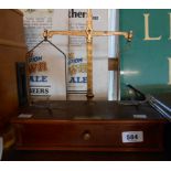 A set of De Grave, Short & Co., Ltd. brass apothecary's scales on wooden stand - incomplete