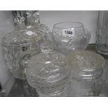 A small selection of cut and moulded glassware including lidded jars, vases and bowls, etc.