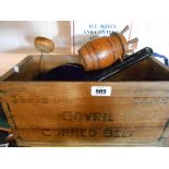 An old wooden packing case for Bovril Corned Beef containing a small quantity of collectable items