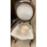 A late Victorian mahogany framed oval panel back bedroom chair with velour upholstery and cabriole