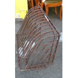 Two large old iron hay racks