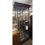A 77cm modern stained wood vitrine with glass shelves enclosed by glazed doors - 1.84m high