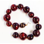 A vintage red amber bead necklace a/f