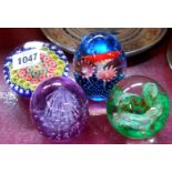 A vintage Murano millefiorie ground paperweight - sold with three other glass paperweights