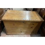 An 89cm Victorian pine lift-top trunk with studded top and flanking iron drop handles