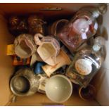 A box containing assorted ceramic and other collectable items including jugs, decanters, silver