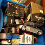 A crate containing a quantity of toy cars including Burago, Eddie Stobart truck, etc.