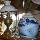 An antique Chinese blue and white ginger jar converted to a lamp - sold with an old brass oil lamp