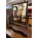 A Victorian mahogany platform dressing table mirror with serpentine front base - sold with a brass