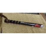 An antique wooden truncheon with red painted Crown motif