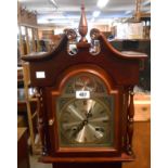 A reproduction mahogany cased Highland granddaughter clock with visible pendulum and faux weights,