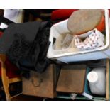 A crate containing assorted collectable items including jewellery cleaner, mortar board, vintage