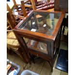 A 37cm early 20th Century stained mahogany free standing table vitrine with all round glazing,