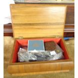 A vintage wooden jewellery box containing a quantity of collectable items including crowns, cased