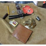 A bag containing a quantity of collectable items including brass frog, vintage glasses, propelling