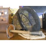 A vintage fencing blade and helmet