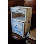 A painted mixed wood bedside pot cupboard with heron decoration