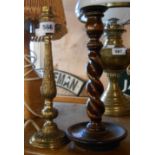 A vintage brass table lamp - sold with an oak barley twist candlestick